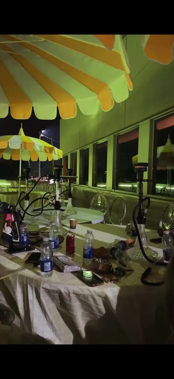 Hookah beside a laid buffet table in a function room