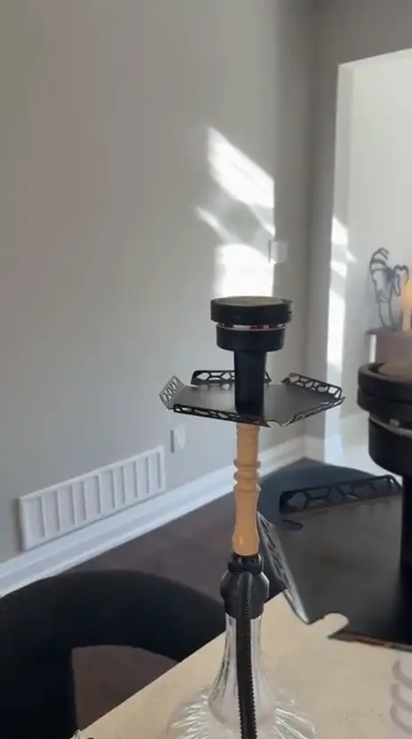 Hookah set up and lit in a private room before guests arrive