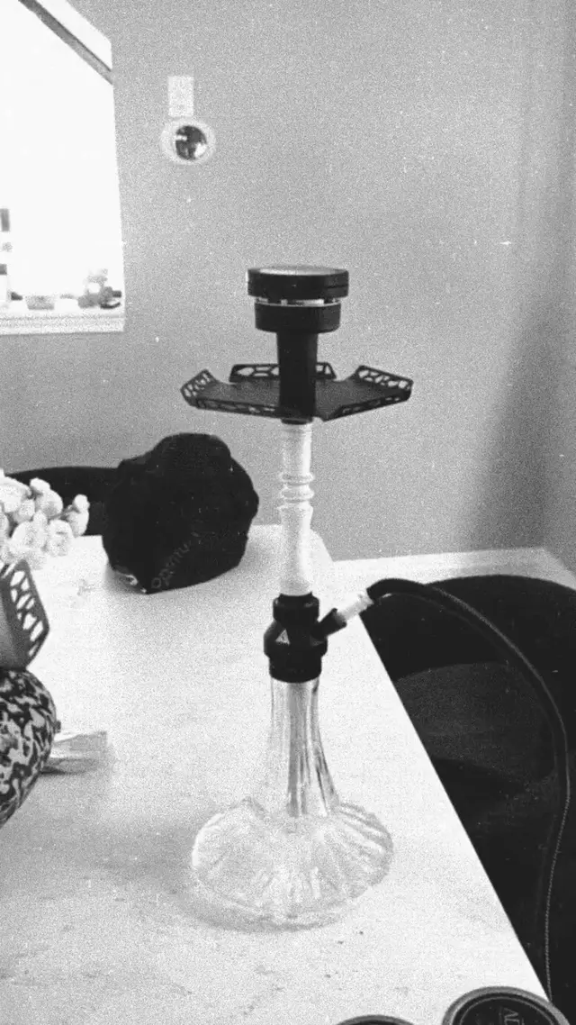 Hookah set up and lit in a private room before guests arrive