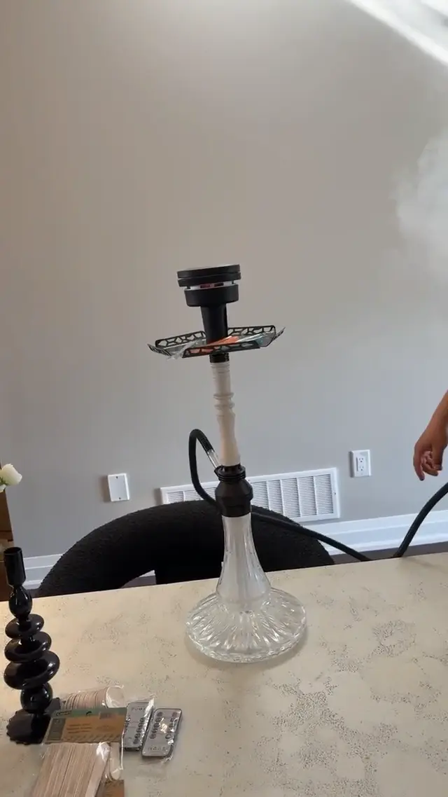 Hookah set up and lit in a private room before guests arrive